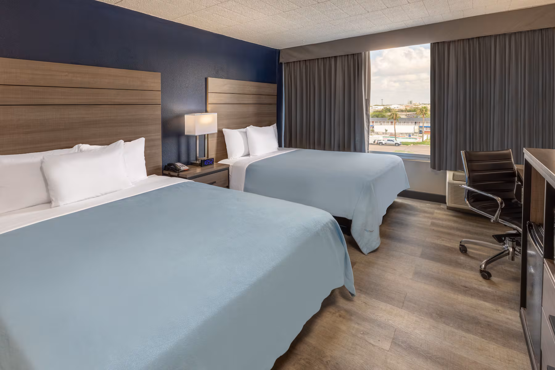 Double queen guest room at Baymont by Wyndham Laredo for travelers visiting near Mall del Norte