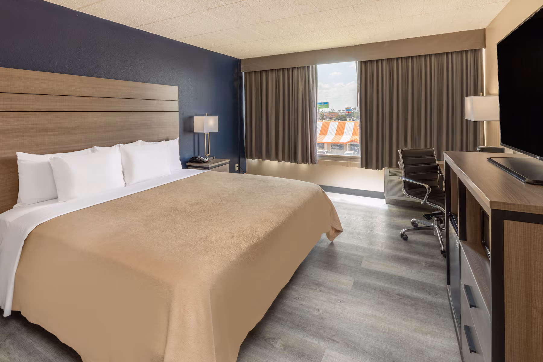 King guest room with desk area at Baymont by Wyndham Laredo near Mall del Norte TX